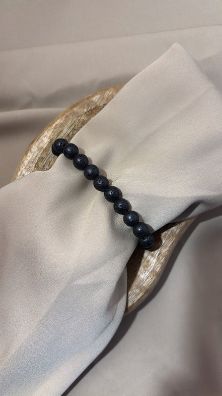 BRACCIALE ELASTICO NERO IN PIETRE VULCANICHE