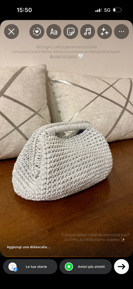 CLUTCH CON MANICO PERLA