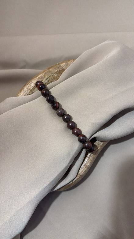 BRACCIALE ELASTICO MARRONE CON PIETRE IN VETRO